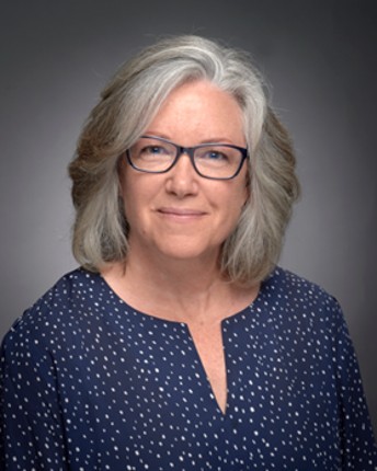 woman smiling with glasses