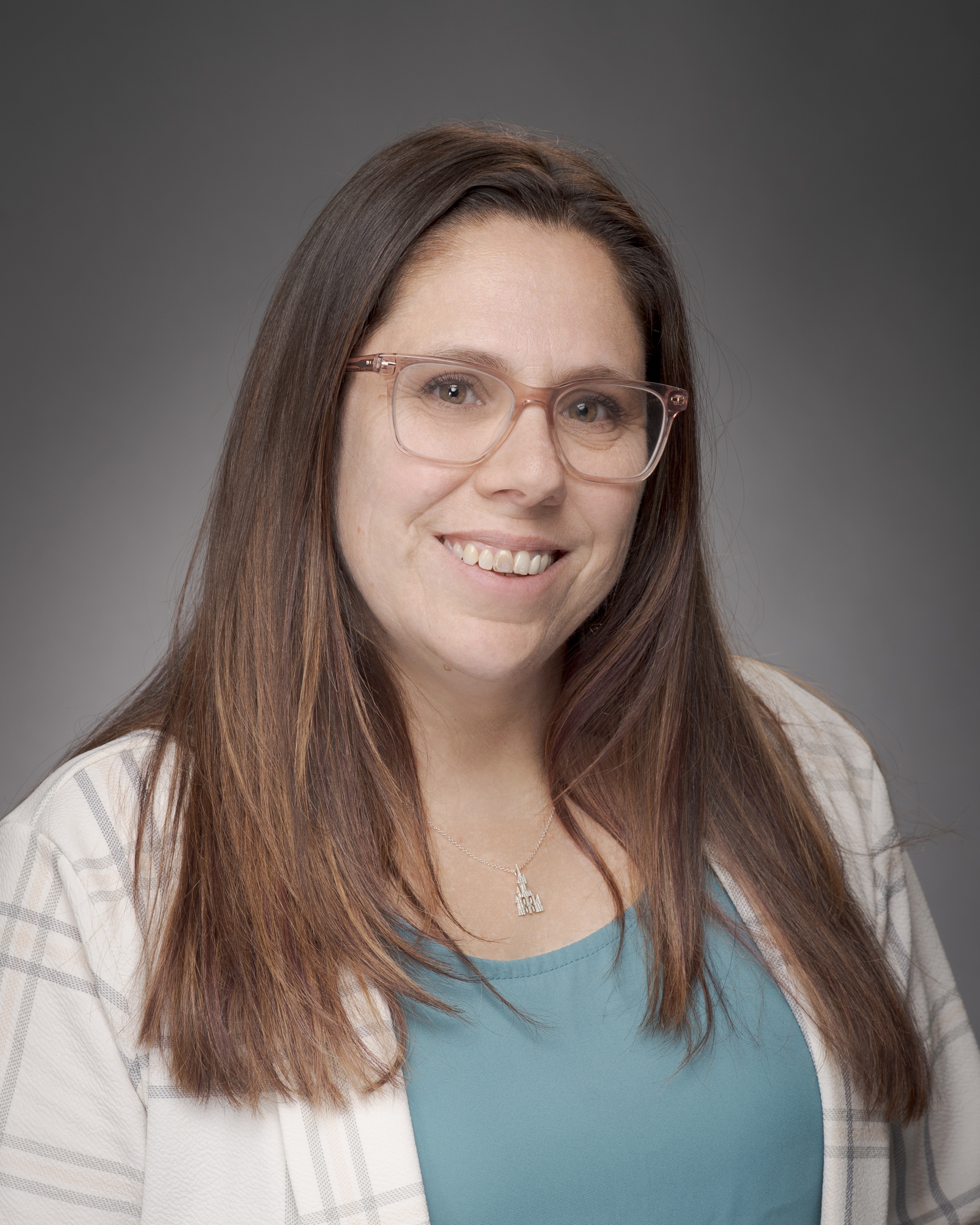 woman wearing glasses smiling